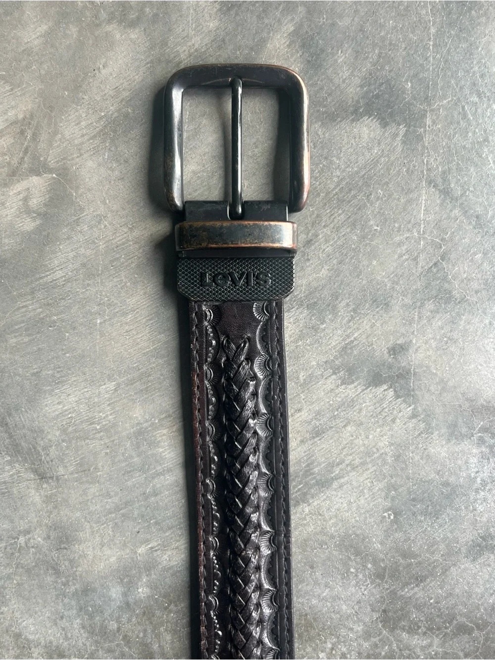 Vintage Levi's black tooled leather western belt with rotating harness buckle